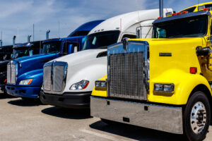 18 Wheeler Accident Lawyer Metairie, LA - colorful Semi Tractor Trailer Trucks Lined up for Sale I
