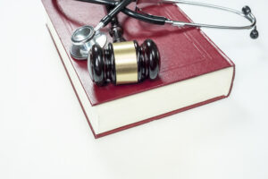 Medical Malpractice Lawyer Metairie, LA - Gavel, stethoscope and book on white background
